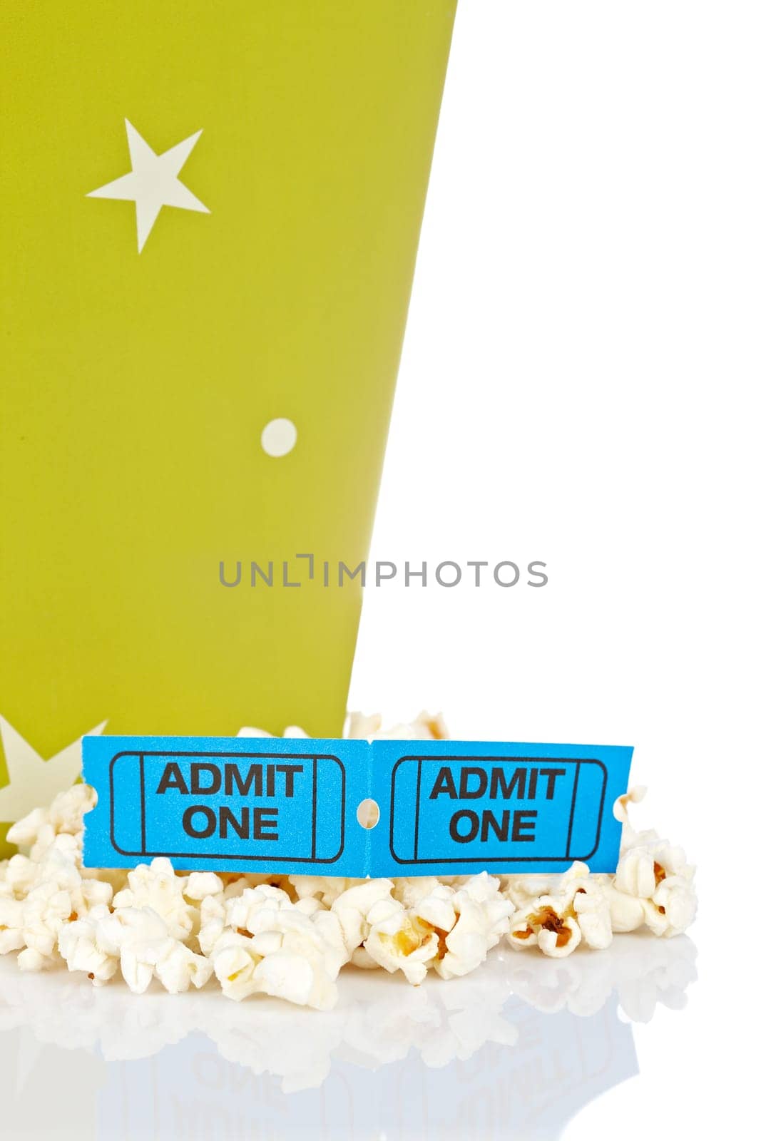 Popcorn bucket with two tickets isolated on a white background. Shallow depth of field