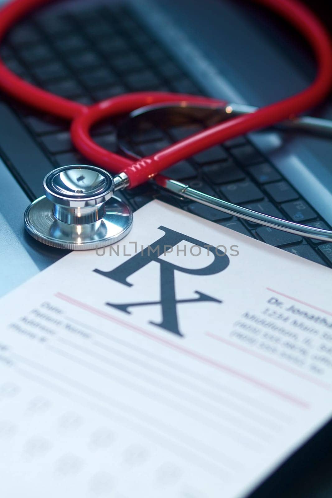 A doctor&#039 s medical stethoscope in moody dark lighting
