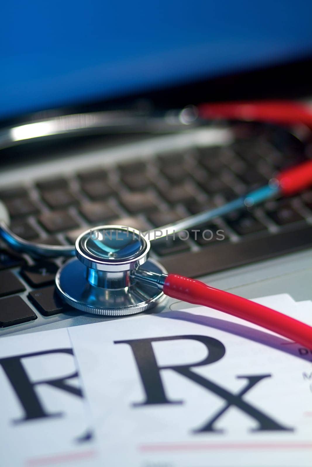 A doctor&#039 s medical stethoscope in moody dark lighting