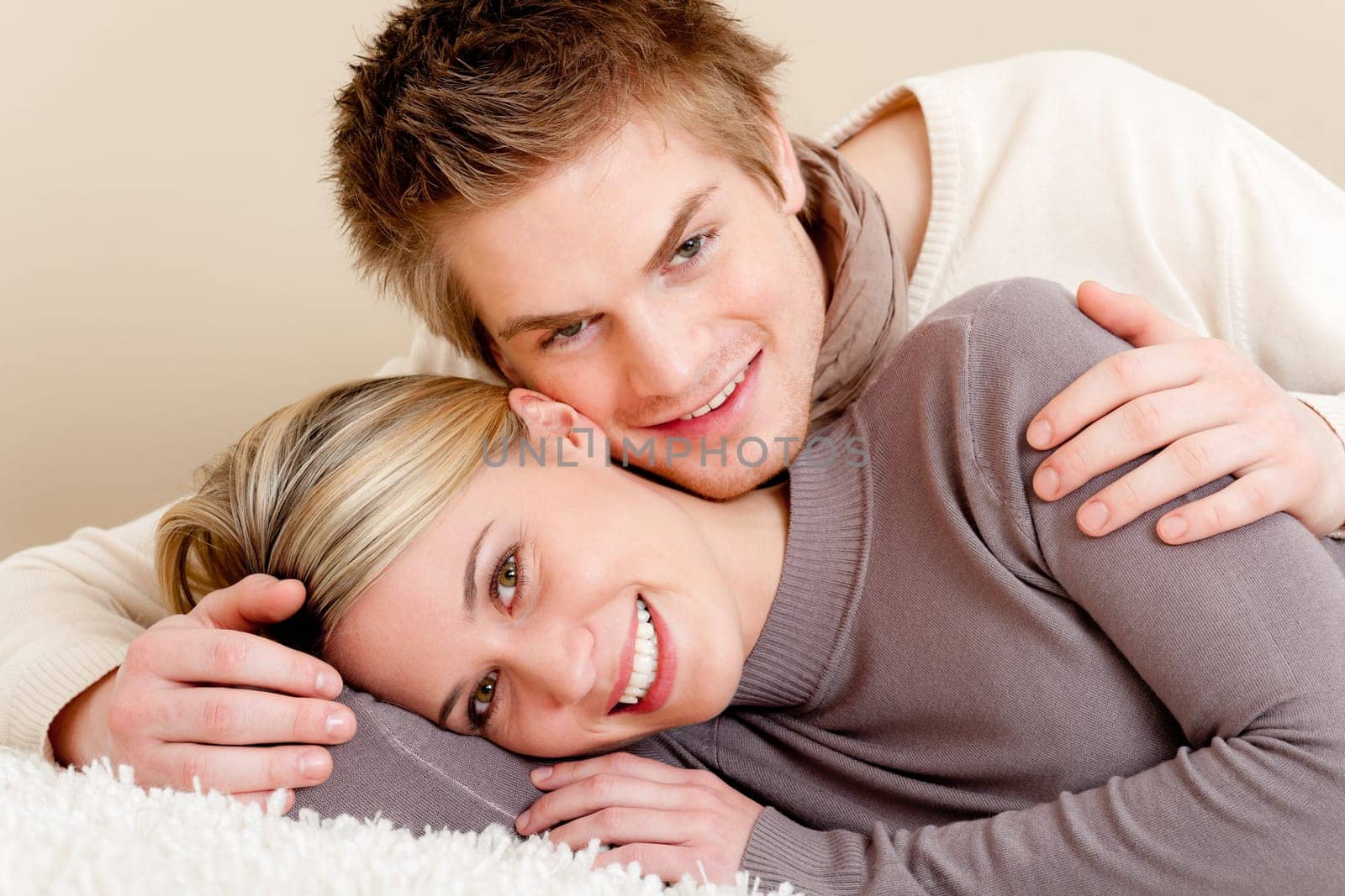 Couple in love - happy relax at home together in living room