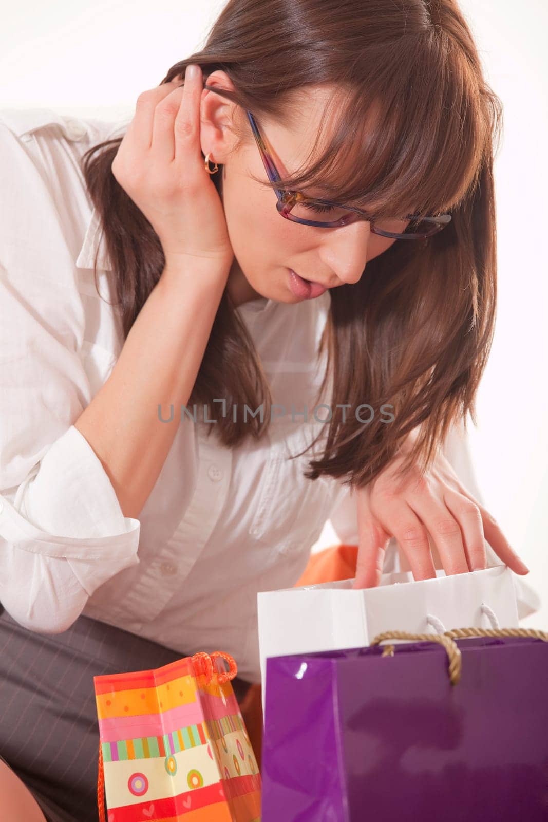 happy woman with shopping bags over white background