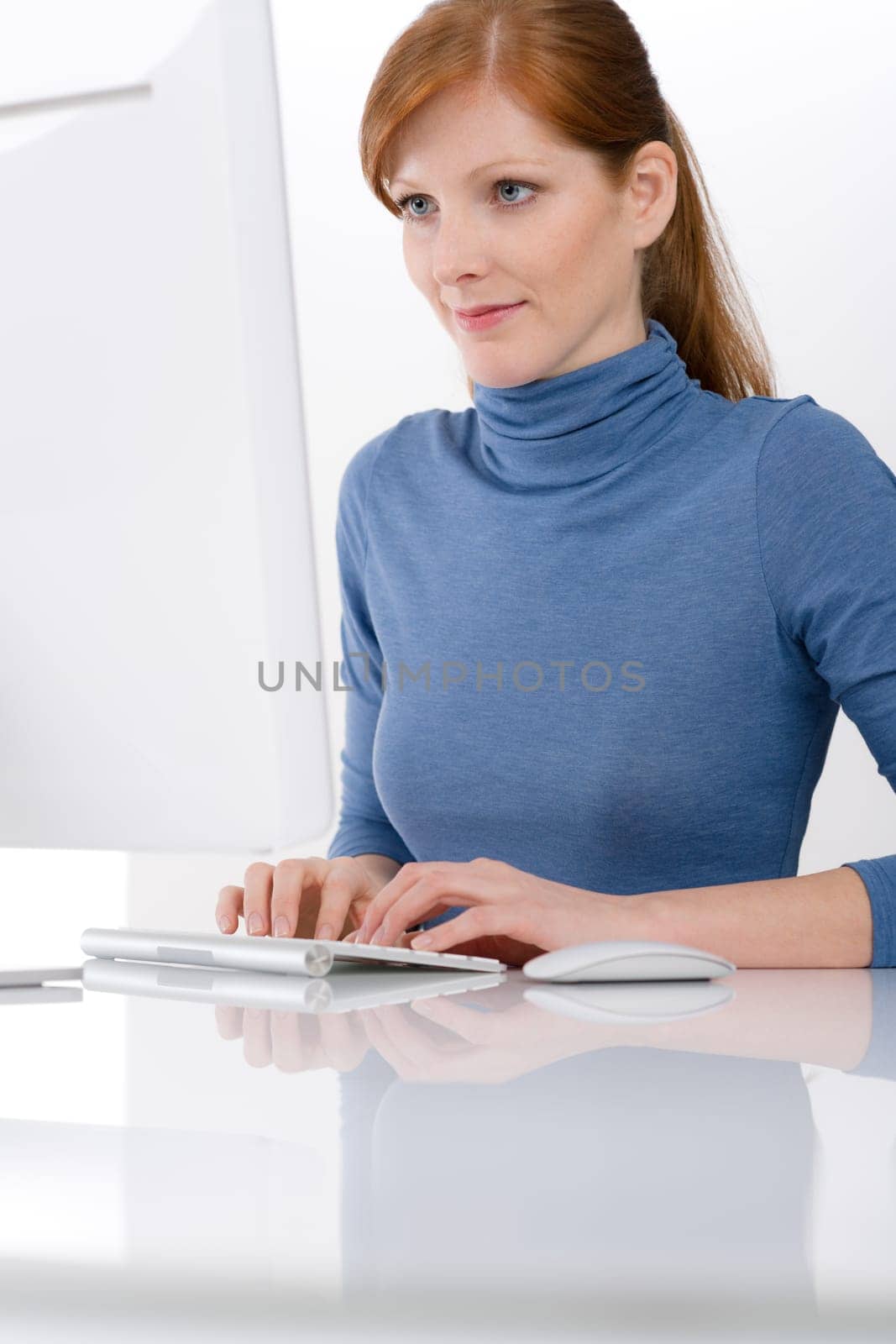Modern office - young business woman work at computer