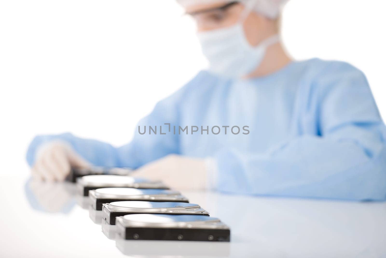 Female computer engineer repair hard disc defect, experiment in sterile laboratory