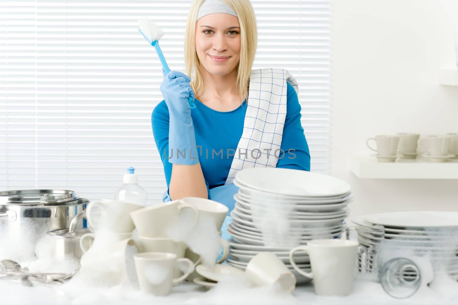 Modern kitchen - happy woman washing dishes, housework