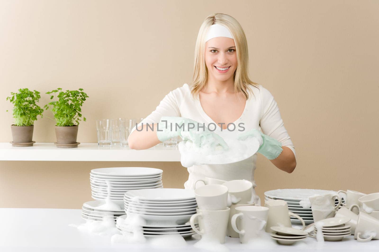 Modern kitchen - happy woman washing dishes, housework