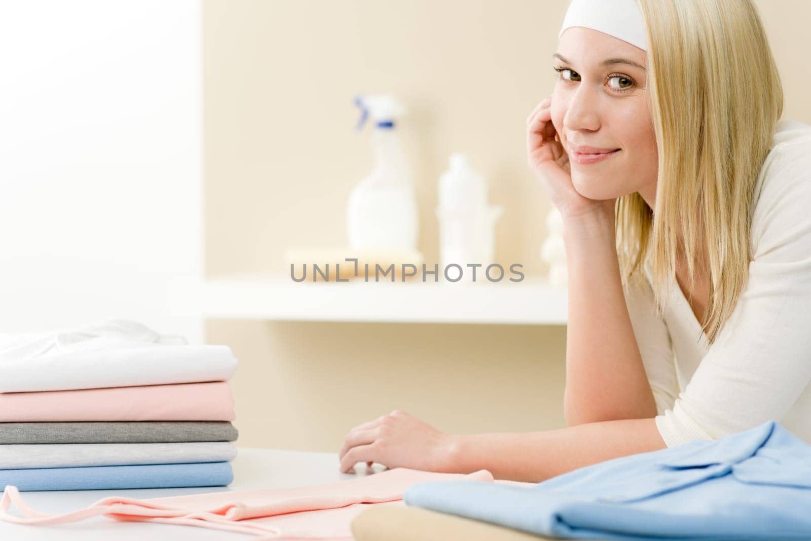 Laundry ironing - woman break after housework home
