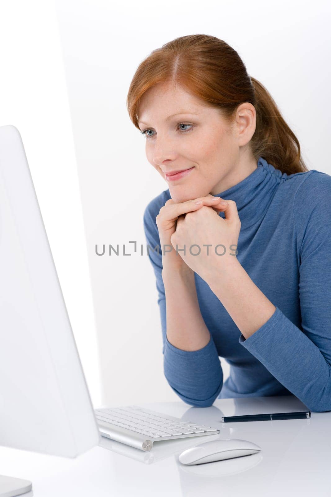 Modern office - young business woman work at computer