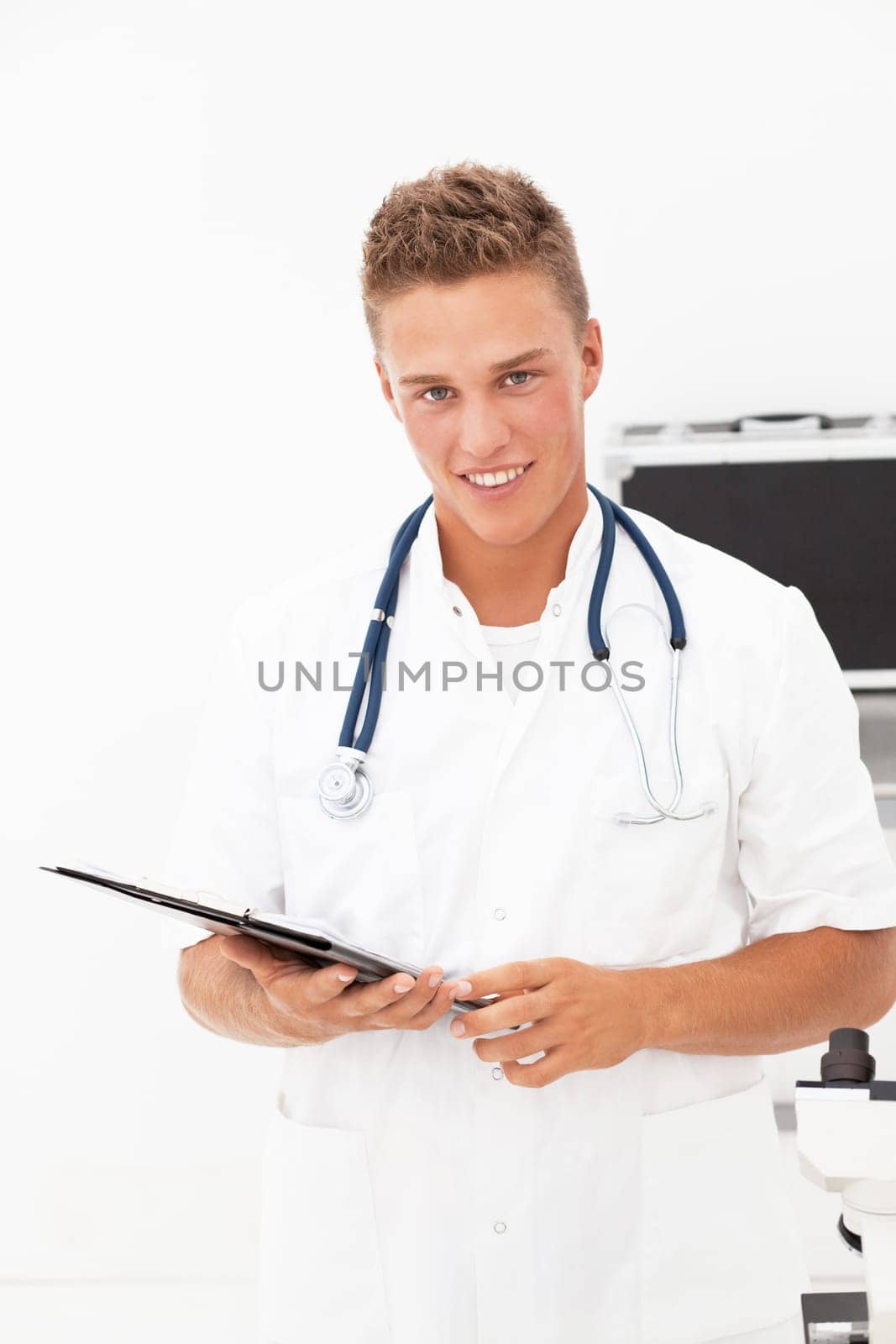 Young blond handsome doctor having good news
