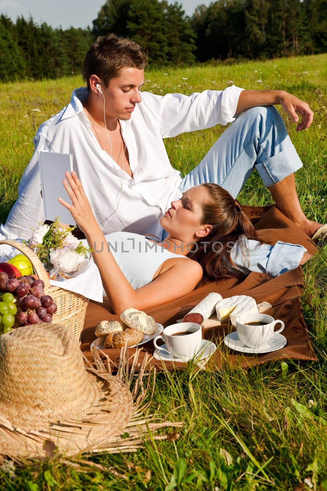 Picnic - Romantic couple in spring nature on sunny day