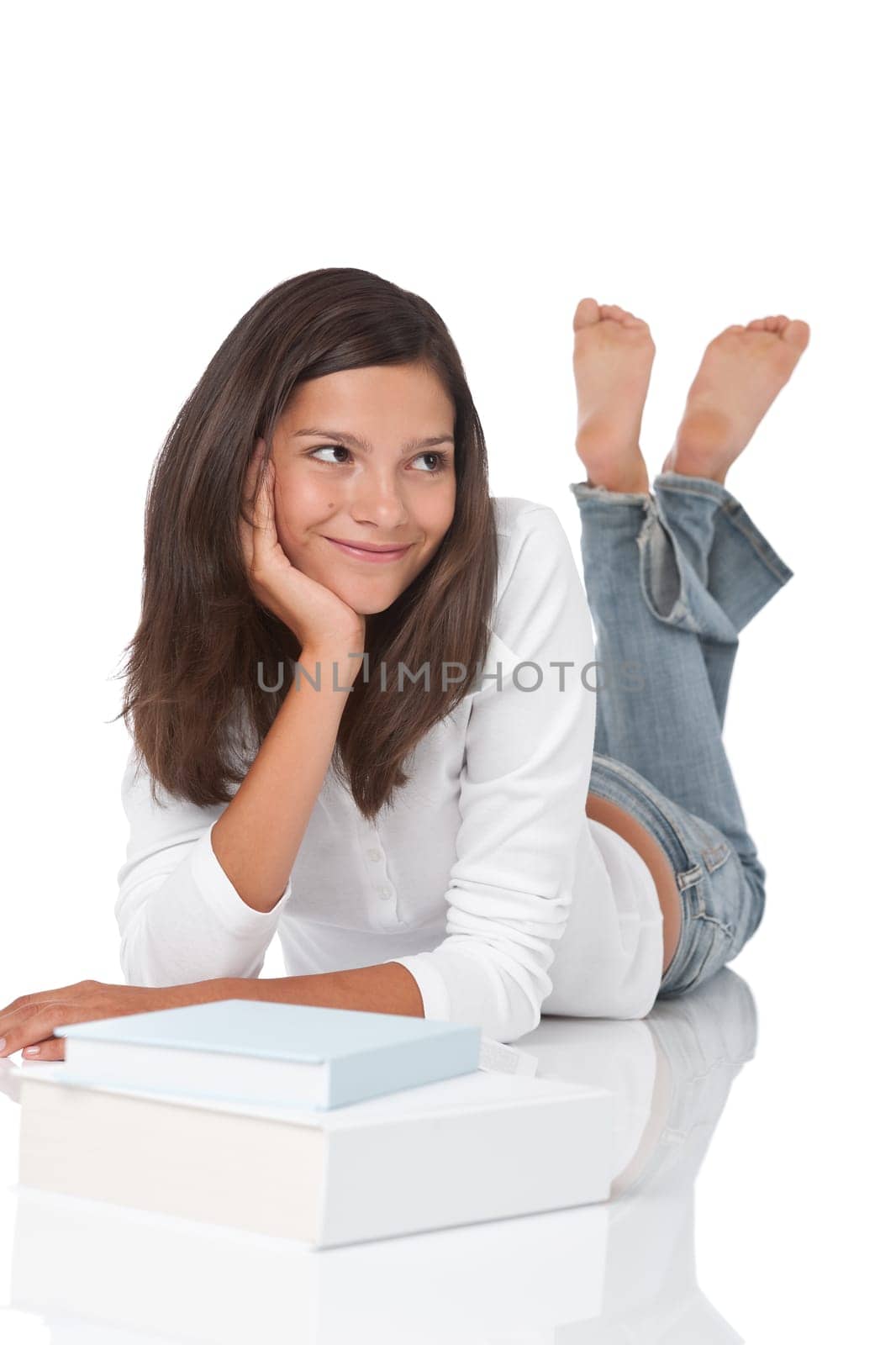 Smiling teenager with books on white background