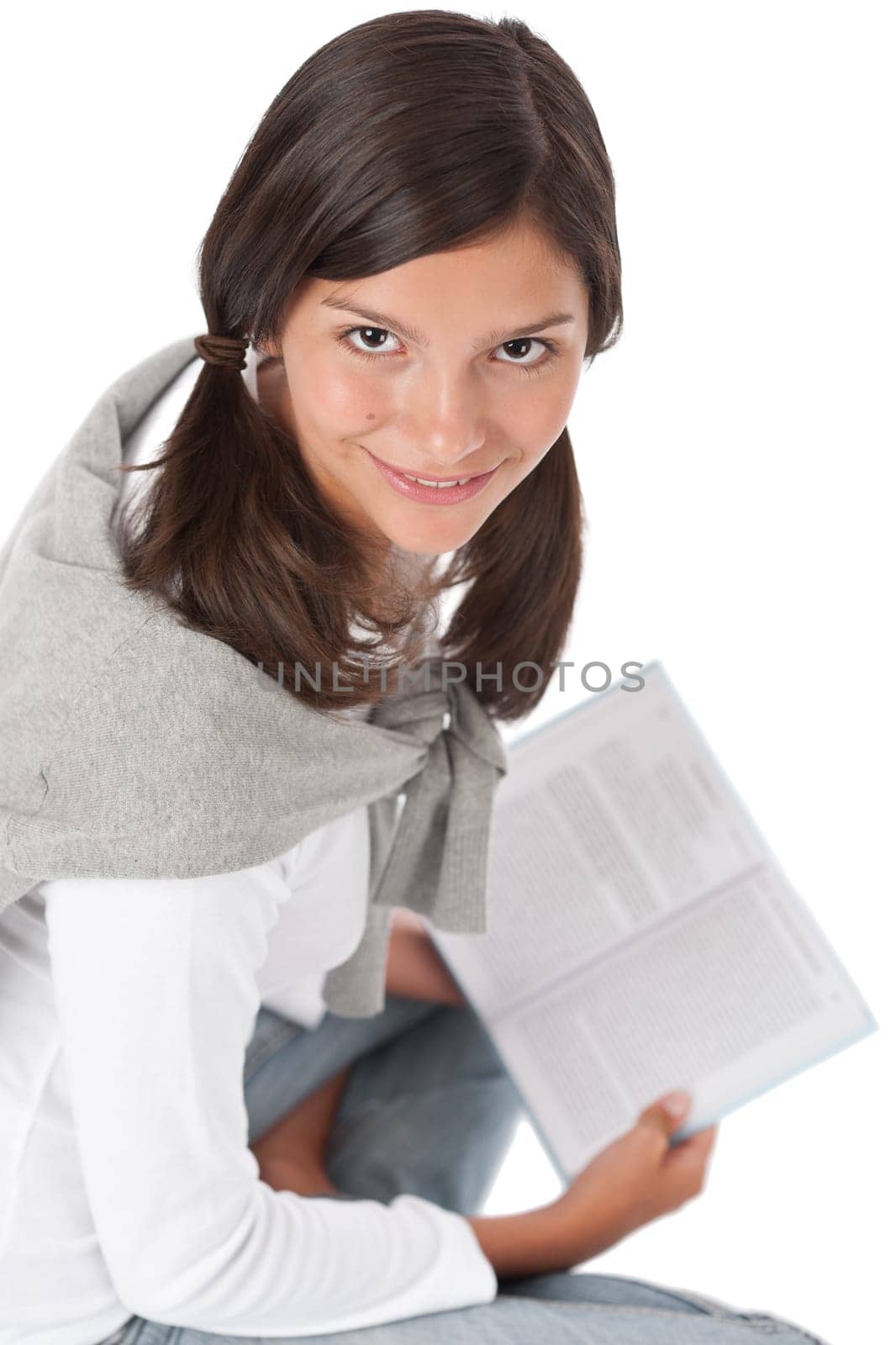 Portrait of teenager reading book on white background