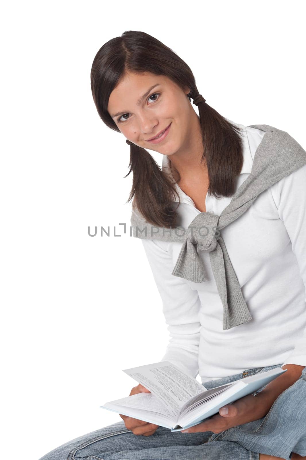 Brown hair teenager holding book on white background