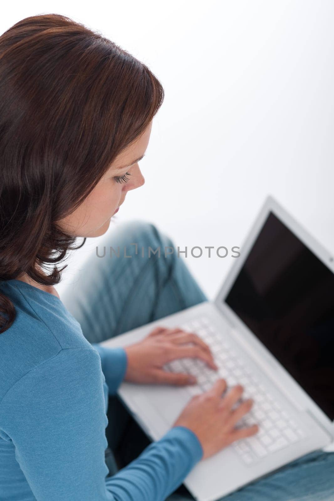 Brown hair woman with laptop on white background