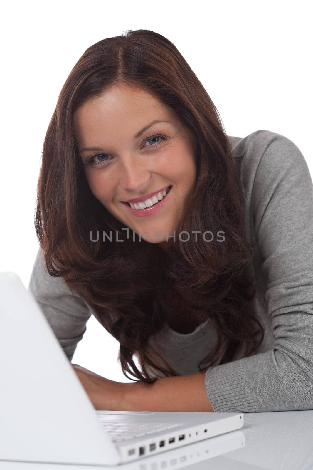 Young smiling happy woman with laptop on white background