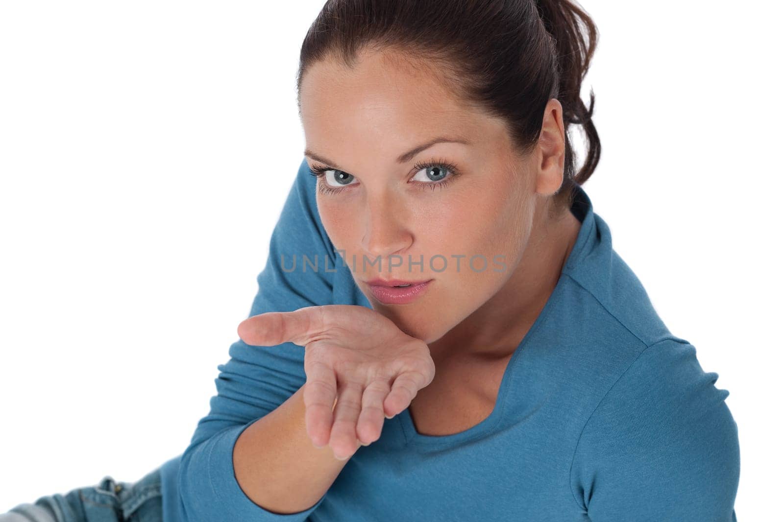 Brown hair woman blowing a kiss on white background
