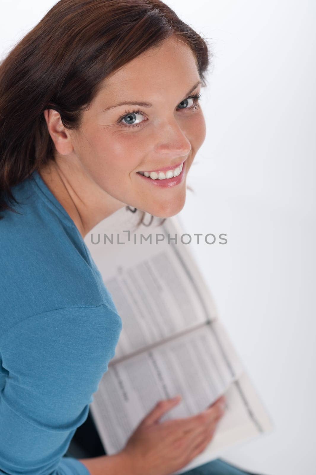 Smiling happy woman with book on white background