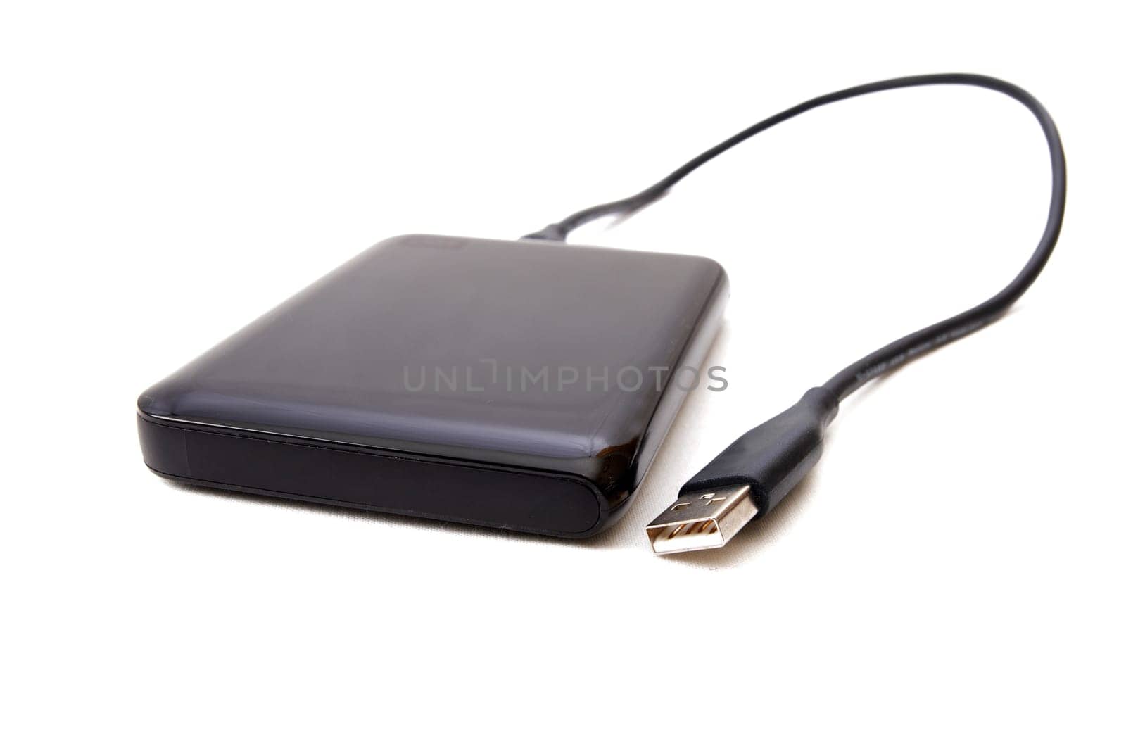 Portable external HDD hard disk drive with USB cable on white background