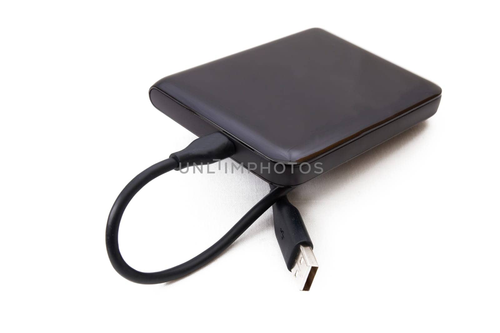 Portable external HDD hard disk drive with USB cable on white background