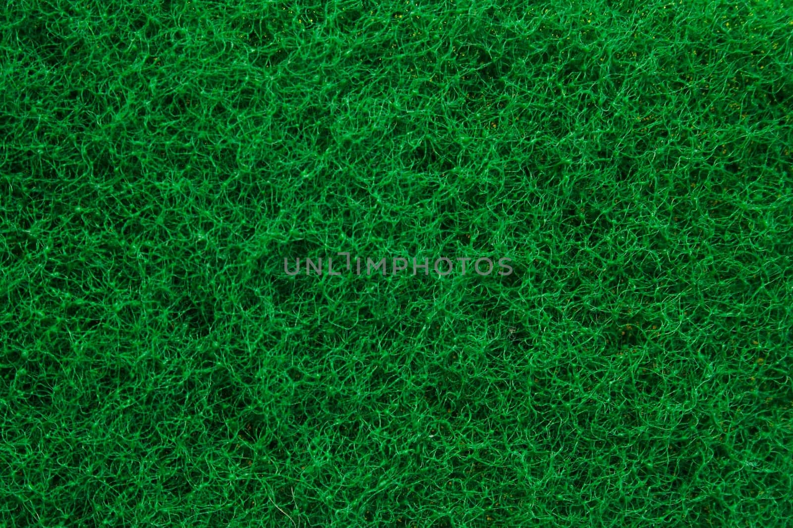 Green abrasive sponge texture background like grass
