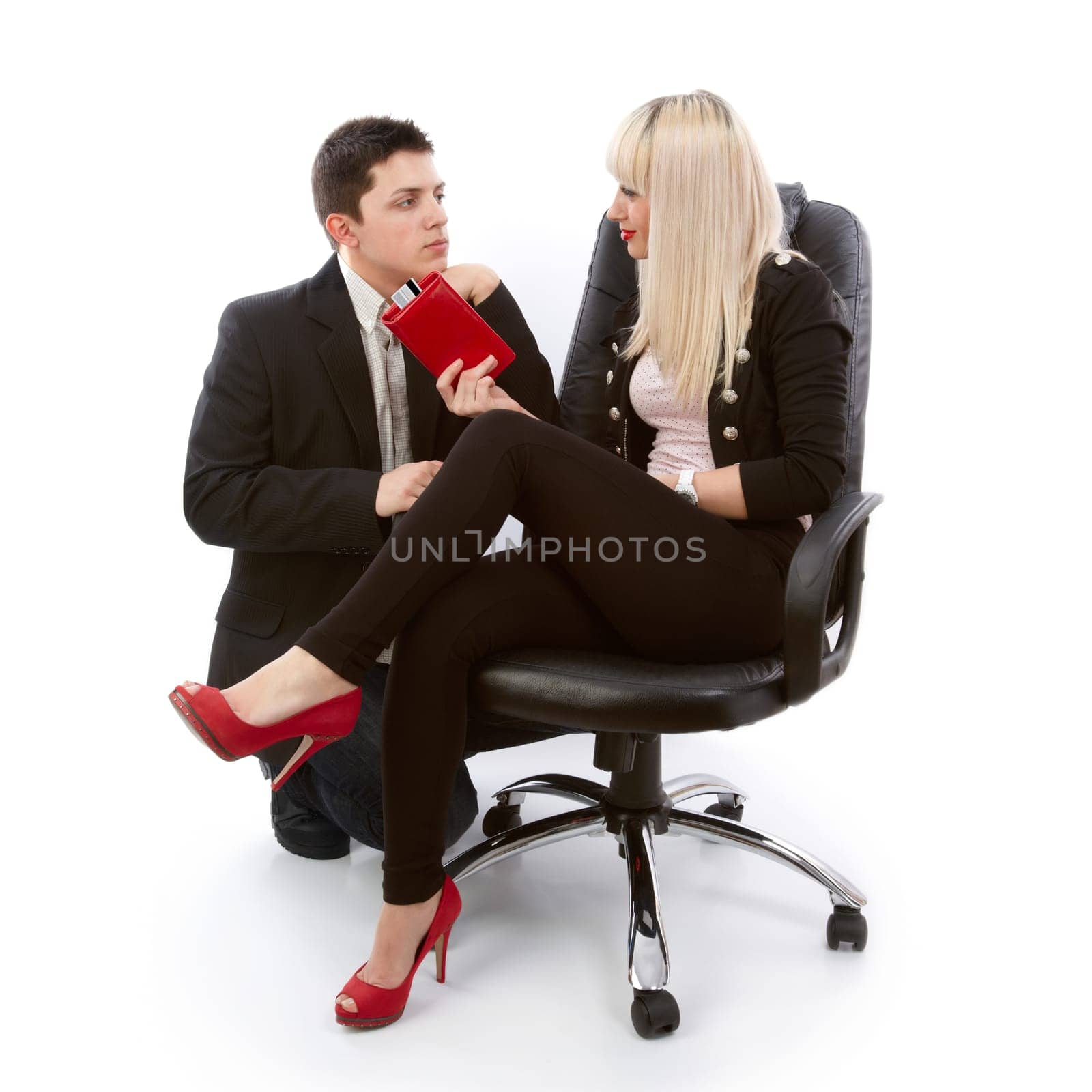 Young woman offering a gift to her boyfriend