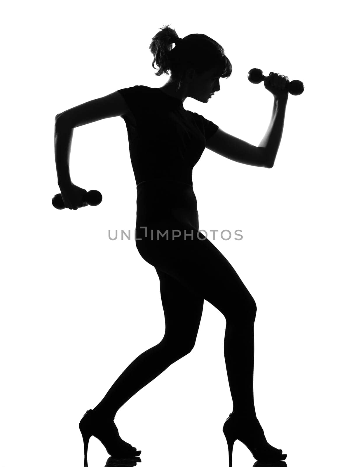 silhouette woman workout body building with dumbells
