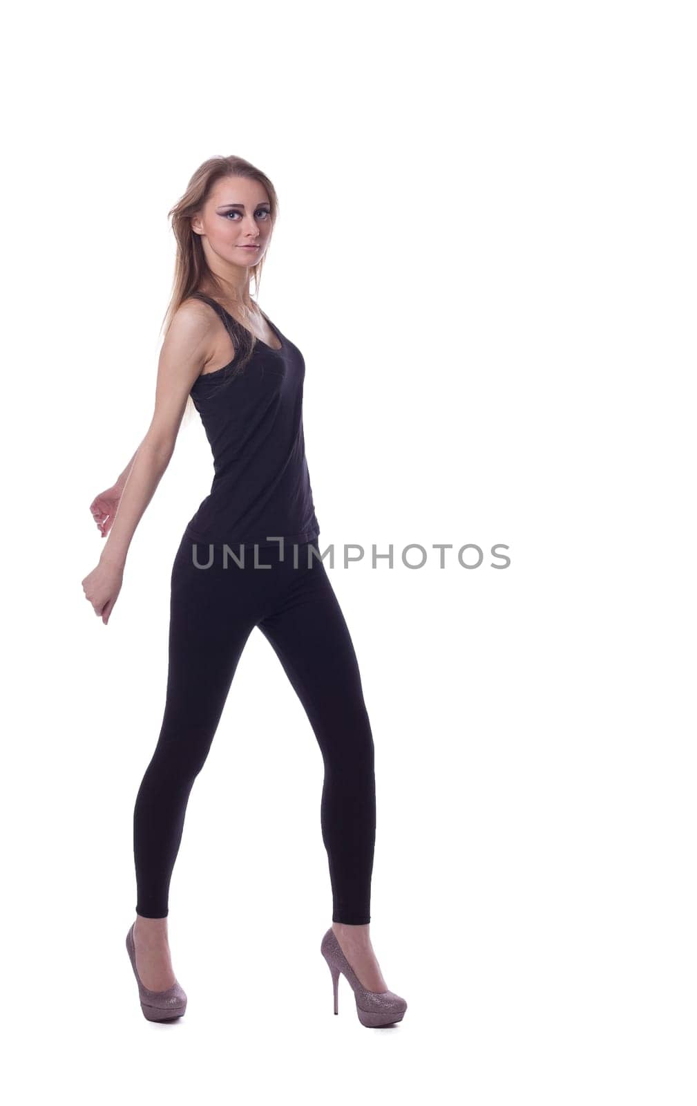 Young tall blond girl in dance pose isolated