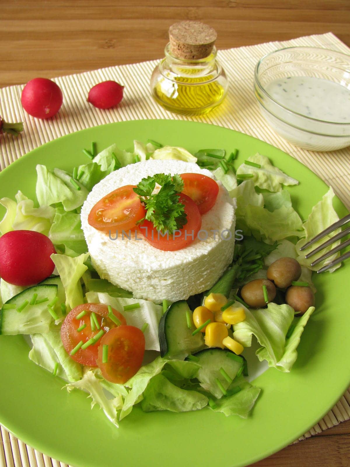 Fresh goat cheese on salad