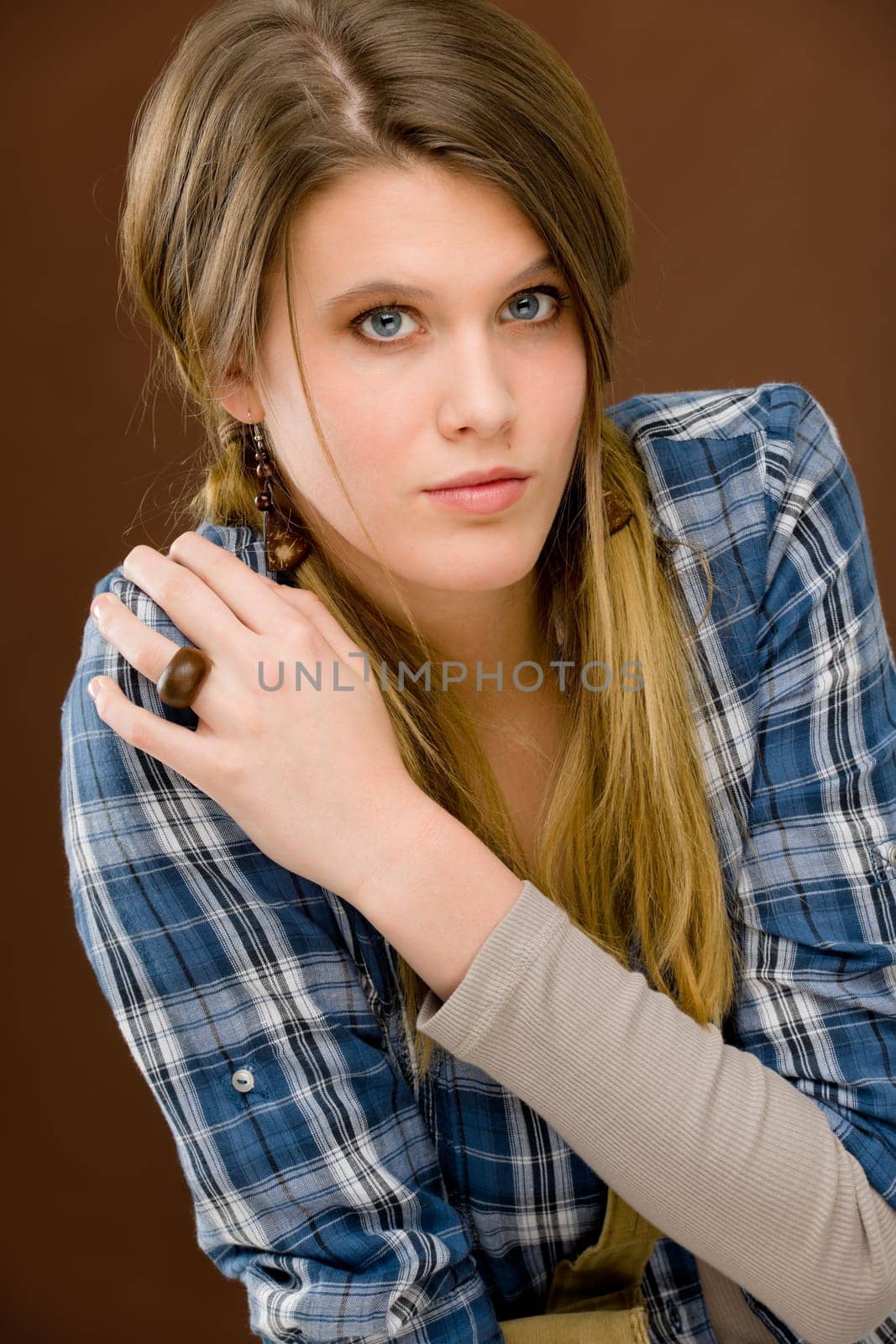 Fashion model - young woman posing in country style clothes