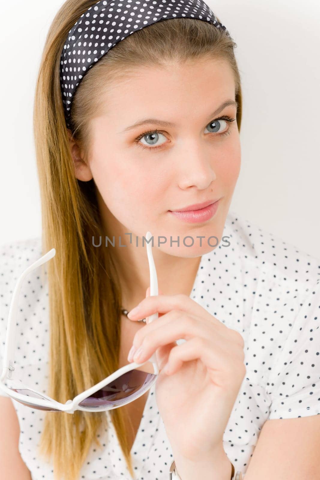 Fashion model - young woman posing in summer designer clothes