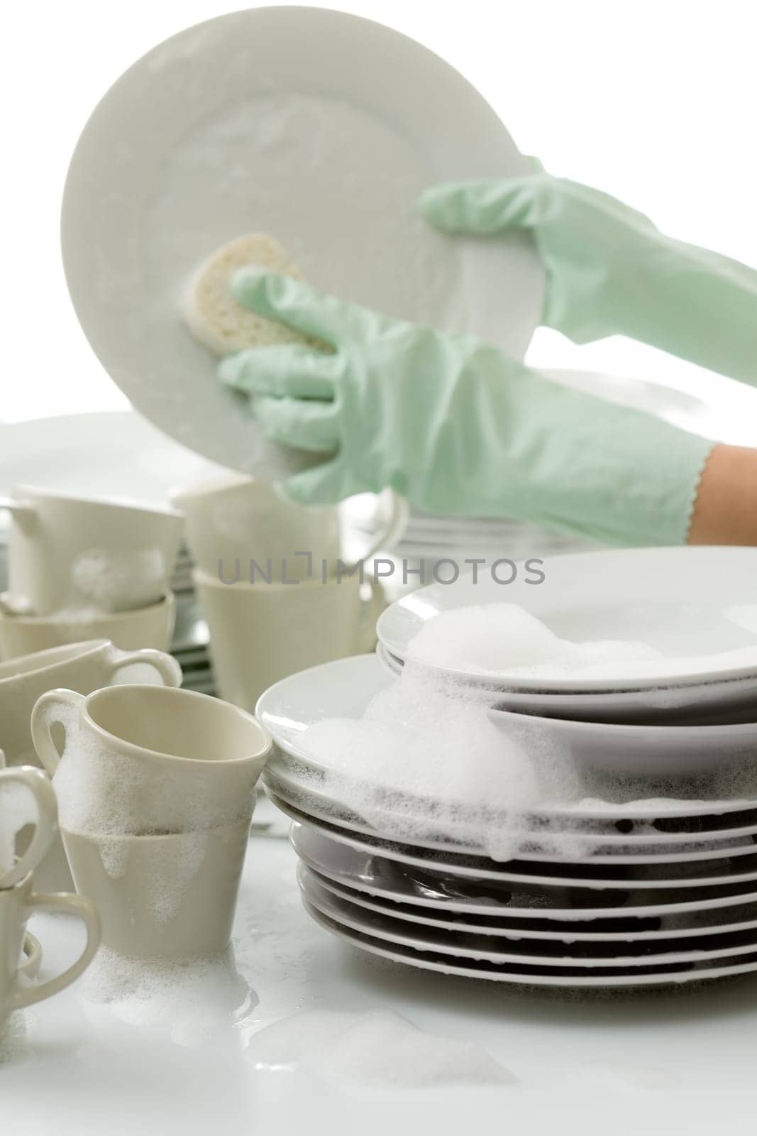 Washing dishes - hands with gloves in kitchen, housework