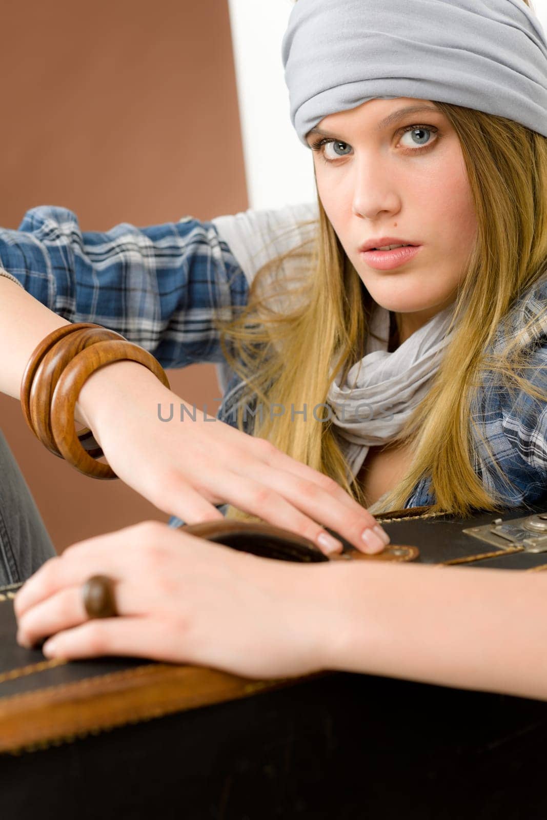 Fashion model - young woman posing in country style clothes