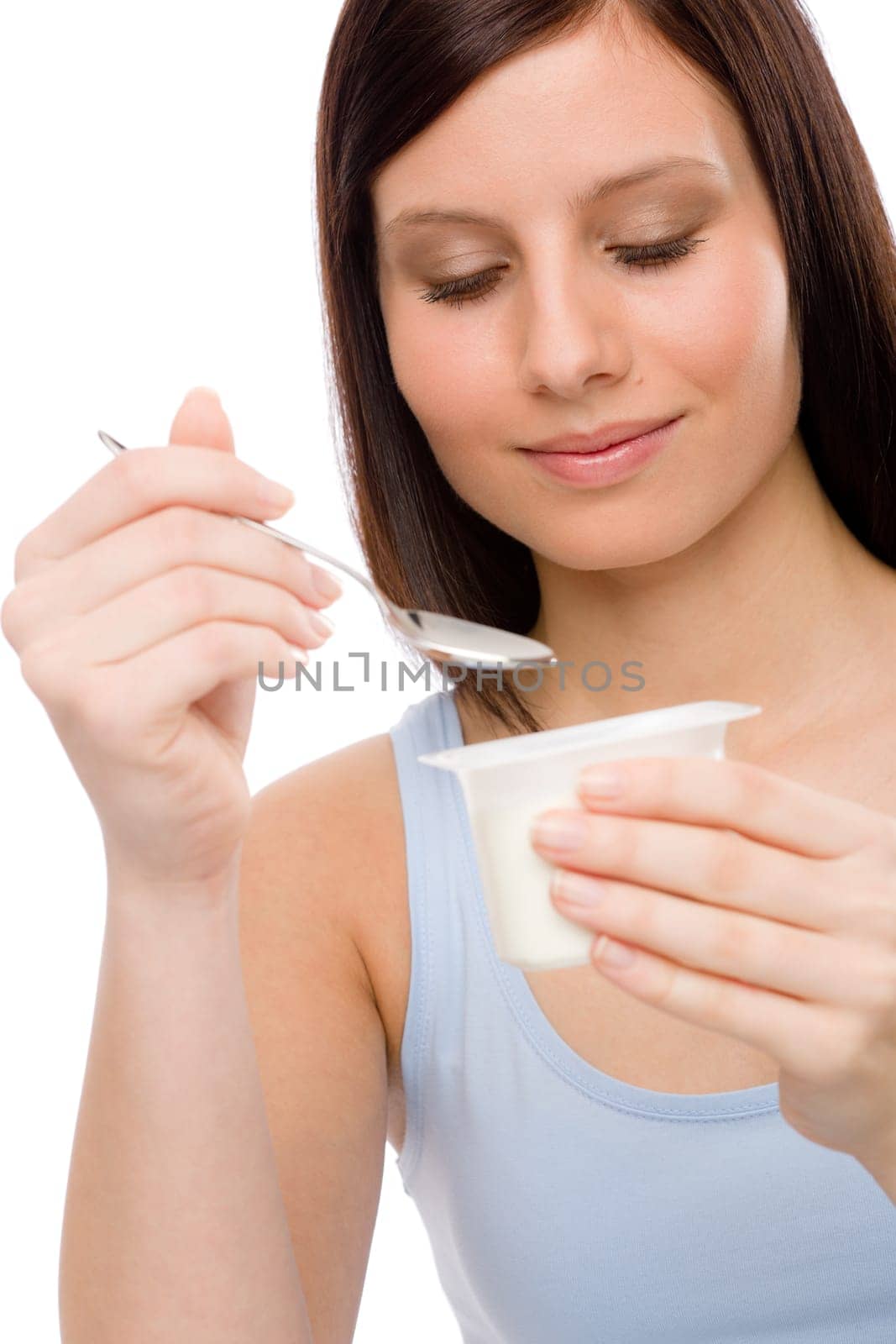 Healthy lifestyle - portrait of young woman eat yogurt