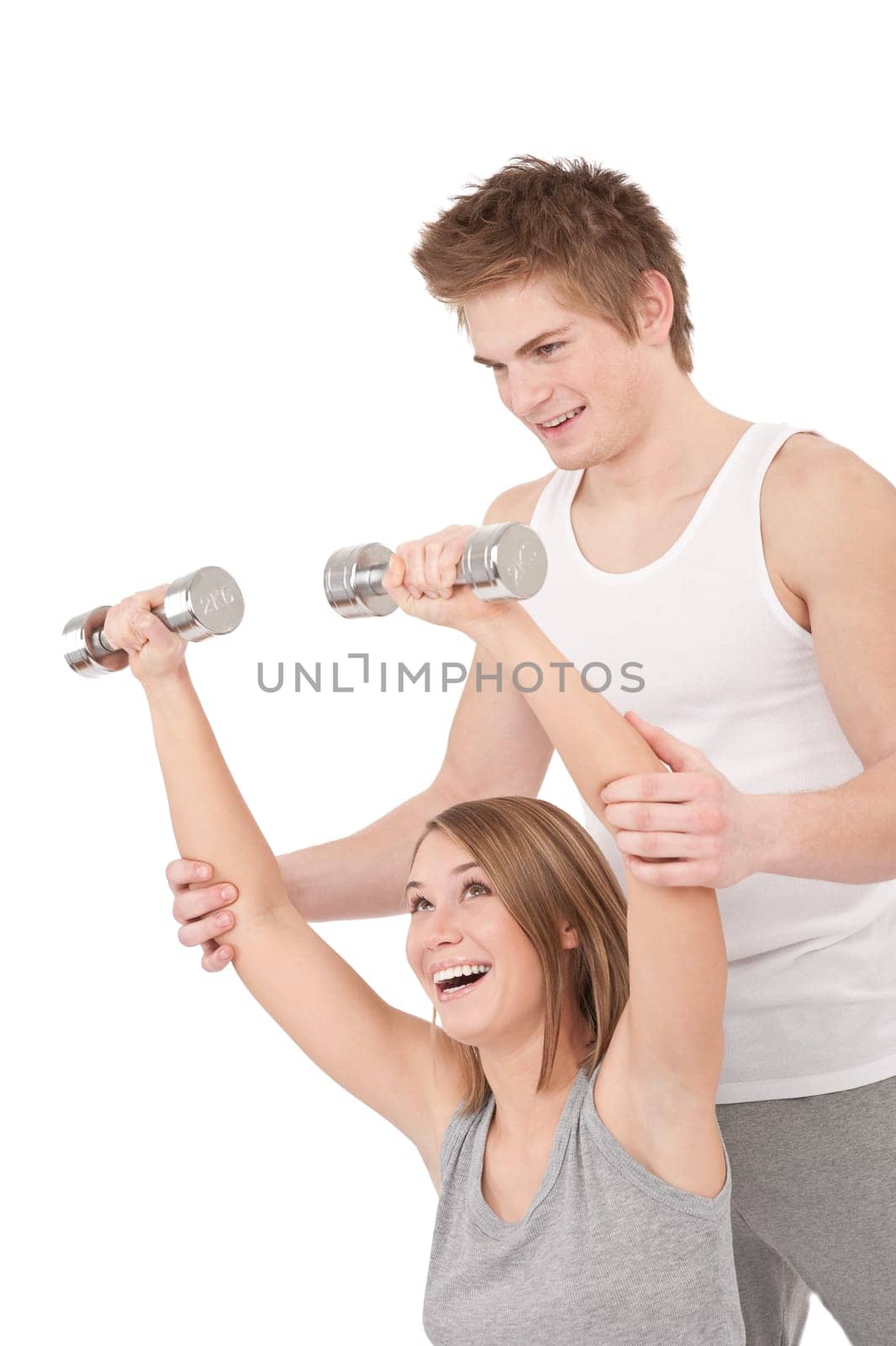 Fitness - Young woman with instructor lifting weights on white background