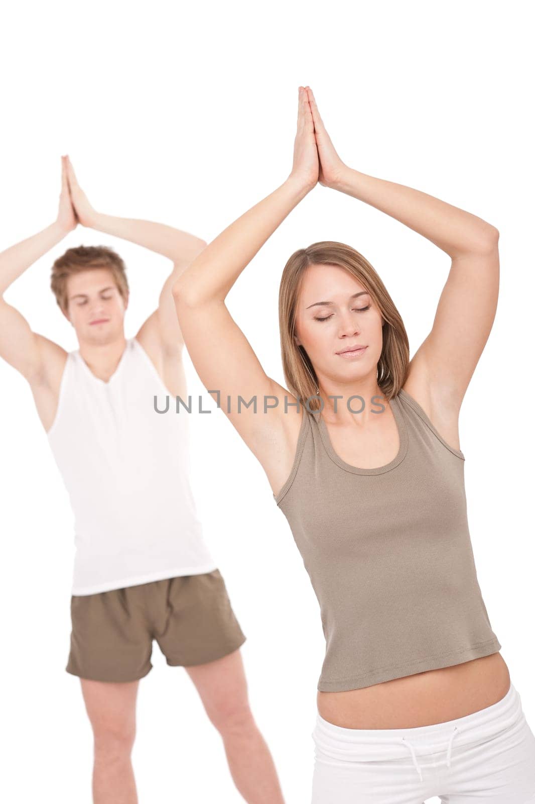 Fitness - Young healthy couple in yoga position on white background