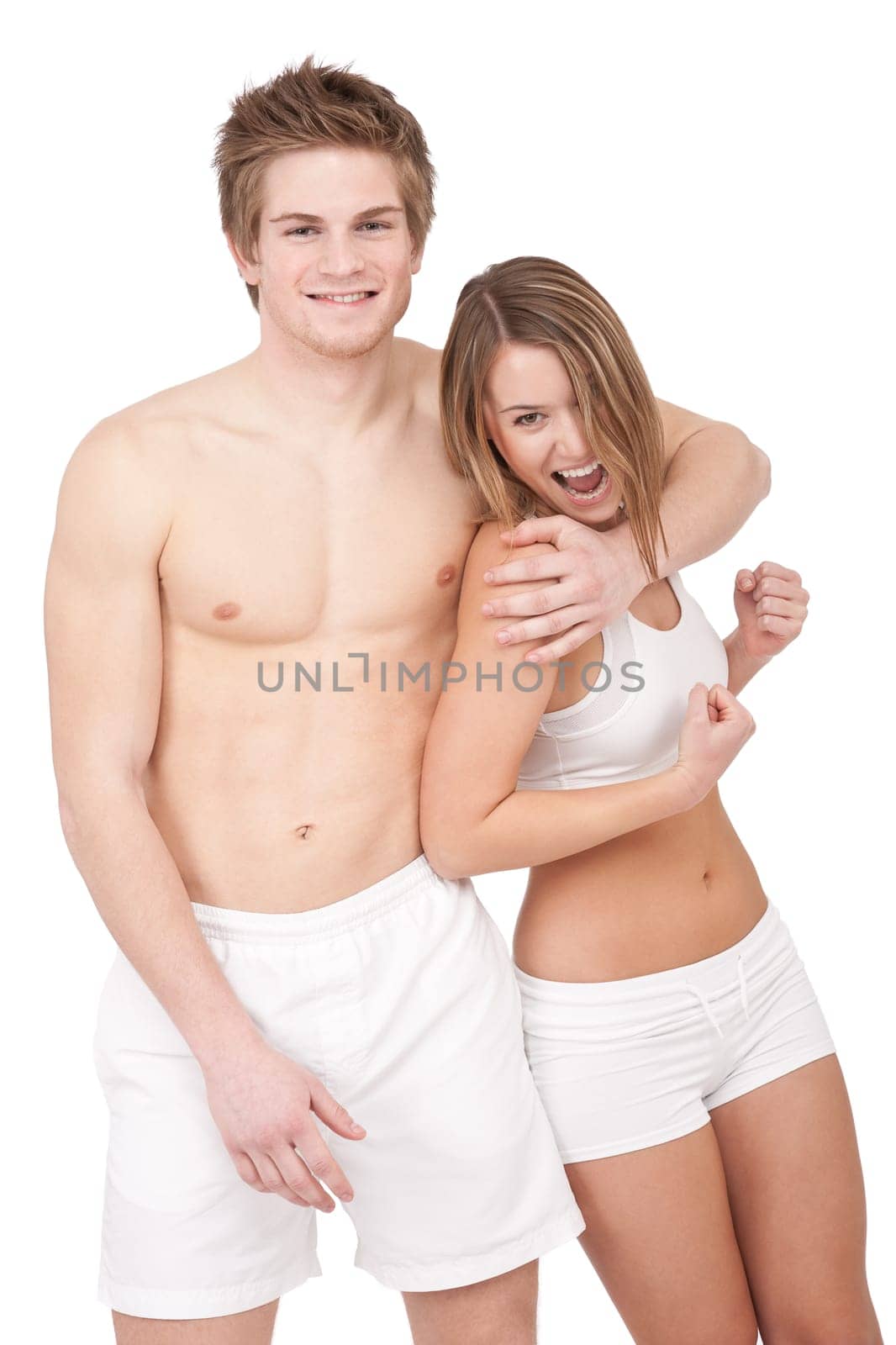 Fitness - Young sportive smiling couple having fun after training on white background