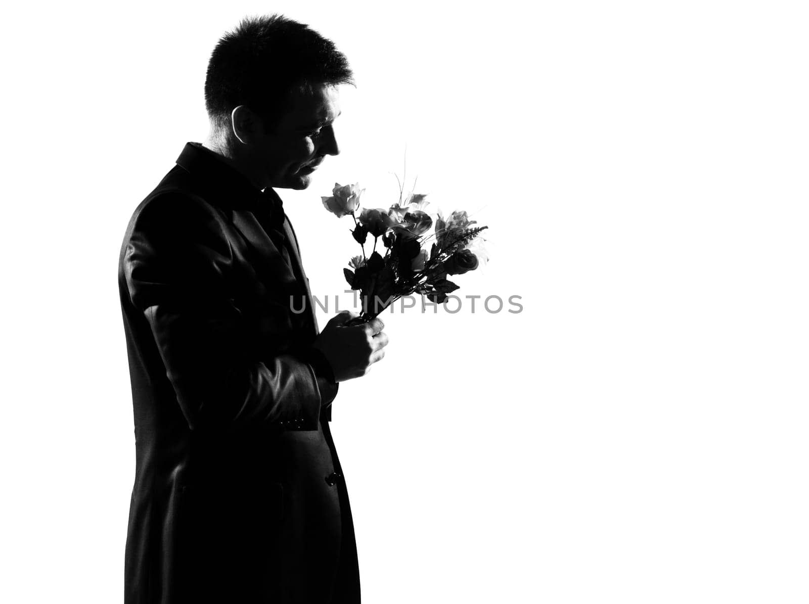 silhouette caucasian business man offering flowers expressing behavior full length on studio isolated white background