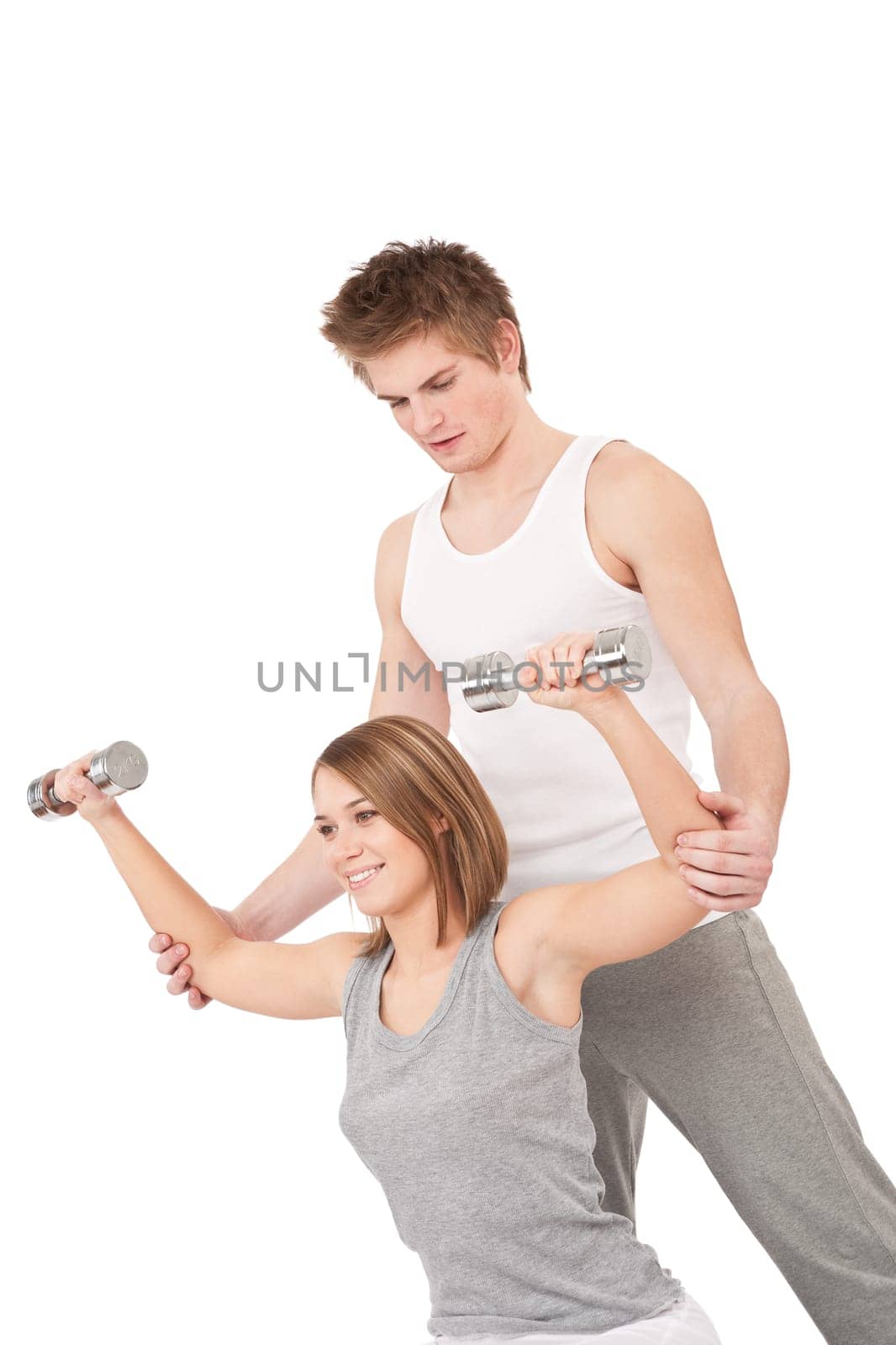 Fitness - Young woman with instructor lifting weights on white background