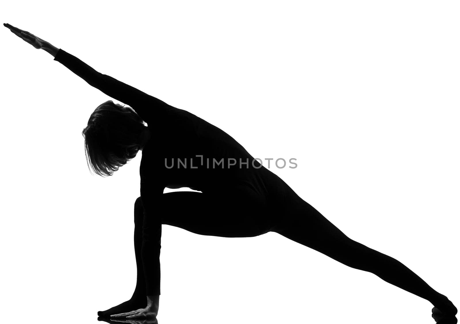 woman yoga posture Extended Side Angle Pose position in silouhette on studio white background
