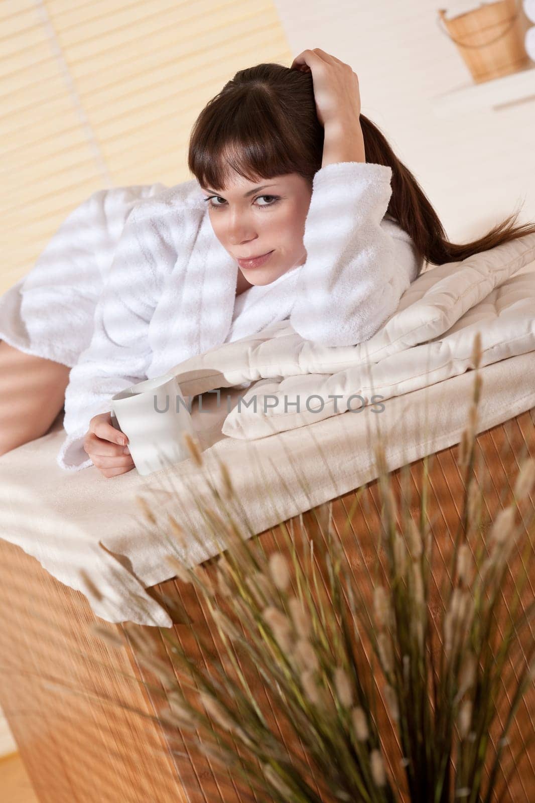 Spa - Young woman at wellness therapy relaxing after massage