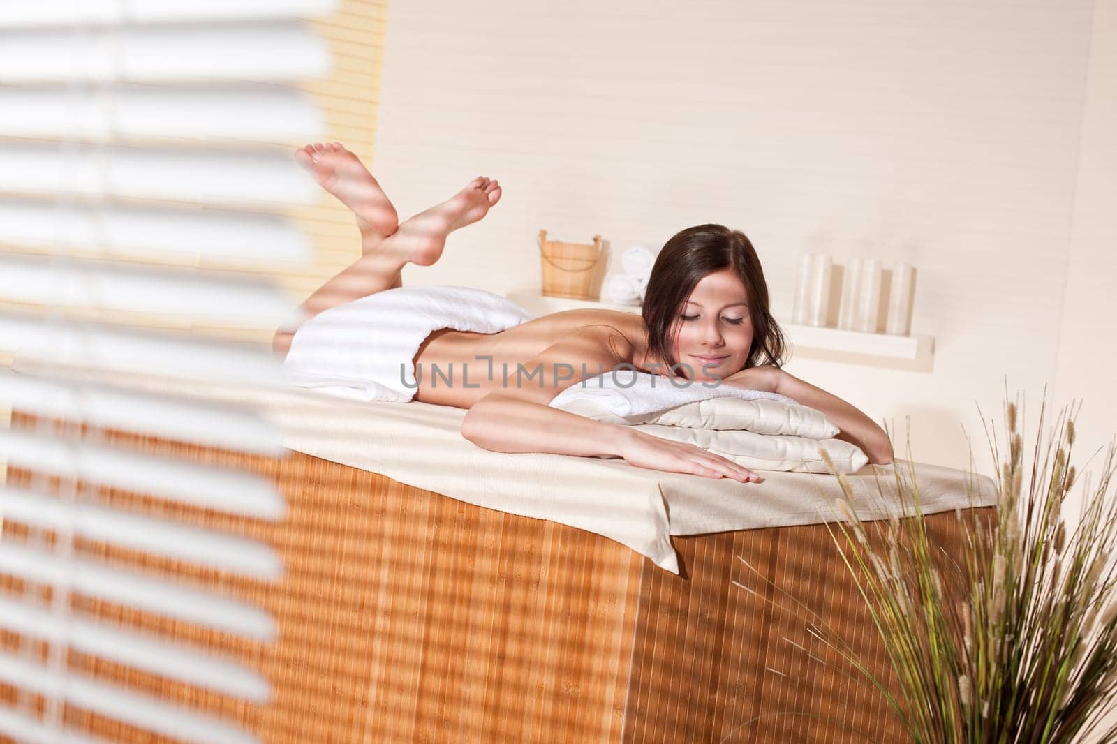 Spa - Young woman at wellness therapy treatment relaxing