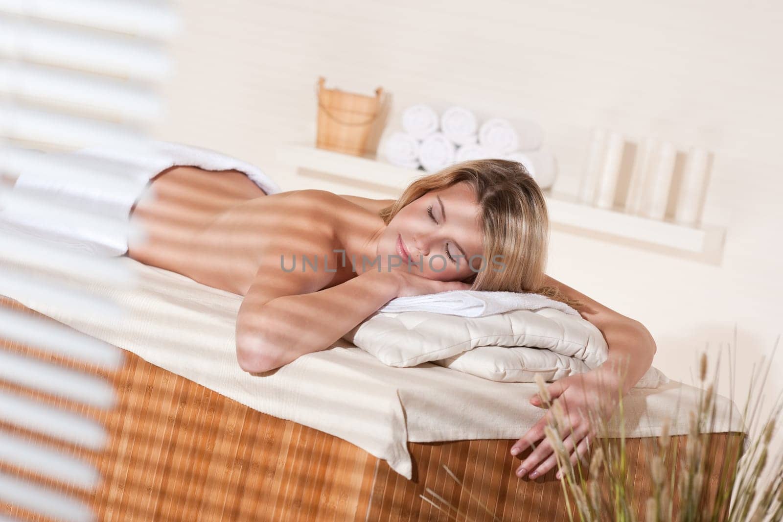 Spa - Young woman at wellness therapy treatment relaxing