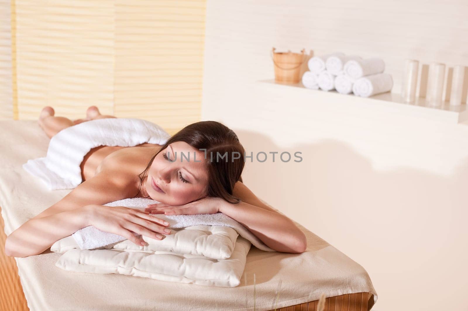Spa - Young woman at wellness therapy treatment relaxing