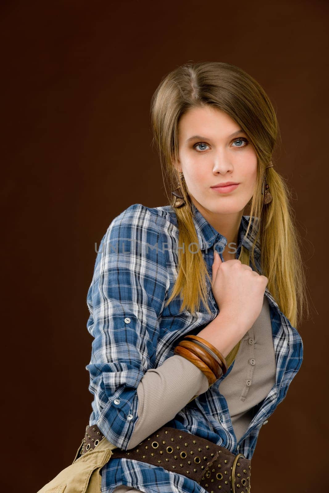 Fashion model - young woman posing in country style clothes