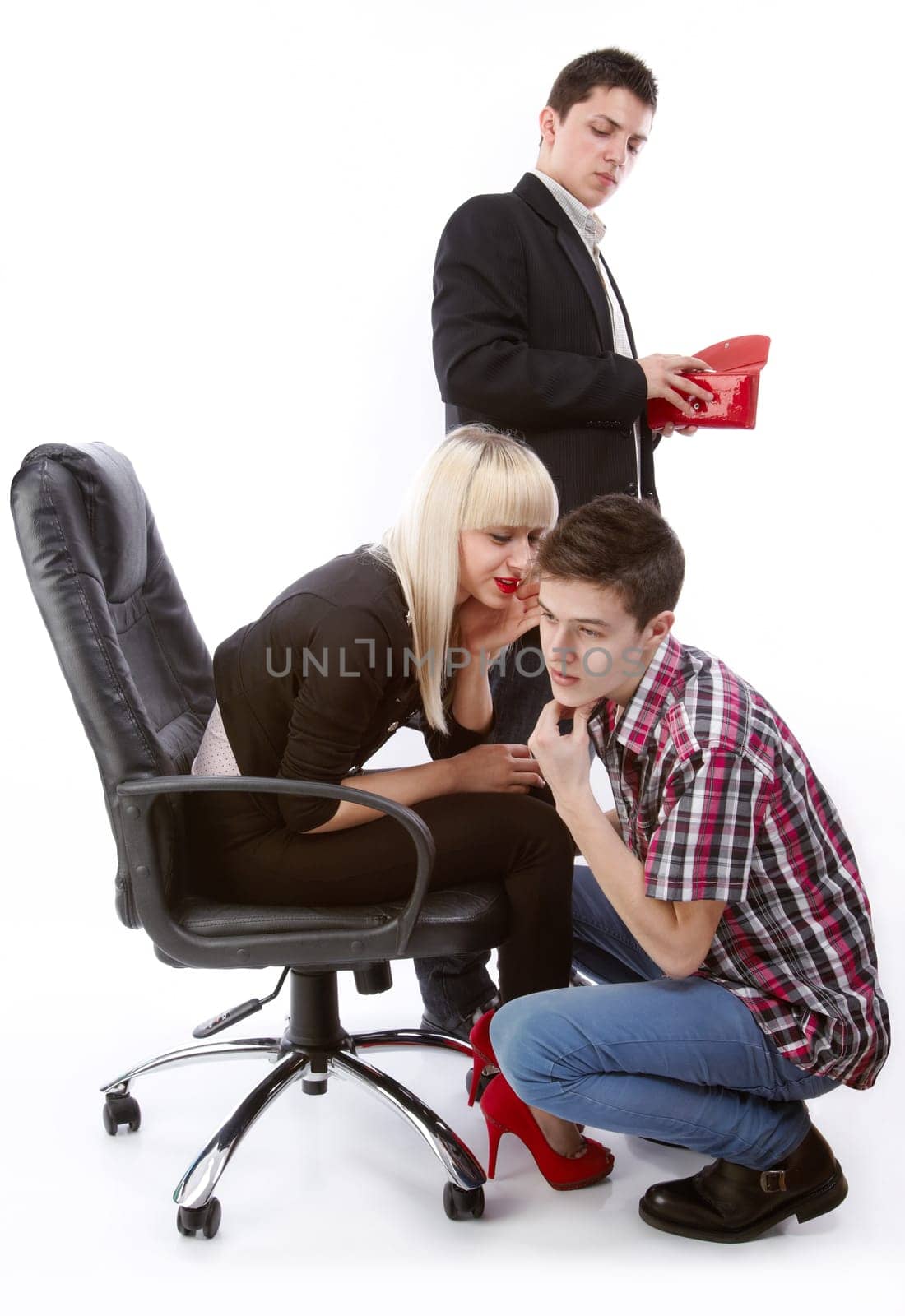 A young man who looks at a woman&#039 s purse who discuss something in secret with another young man.