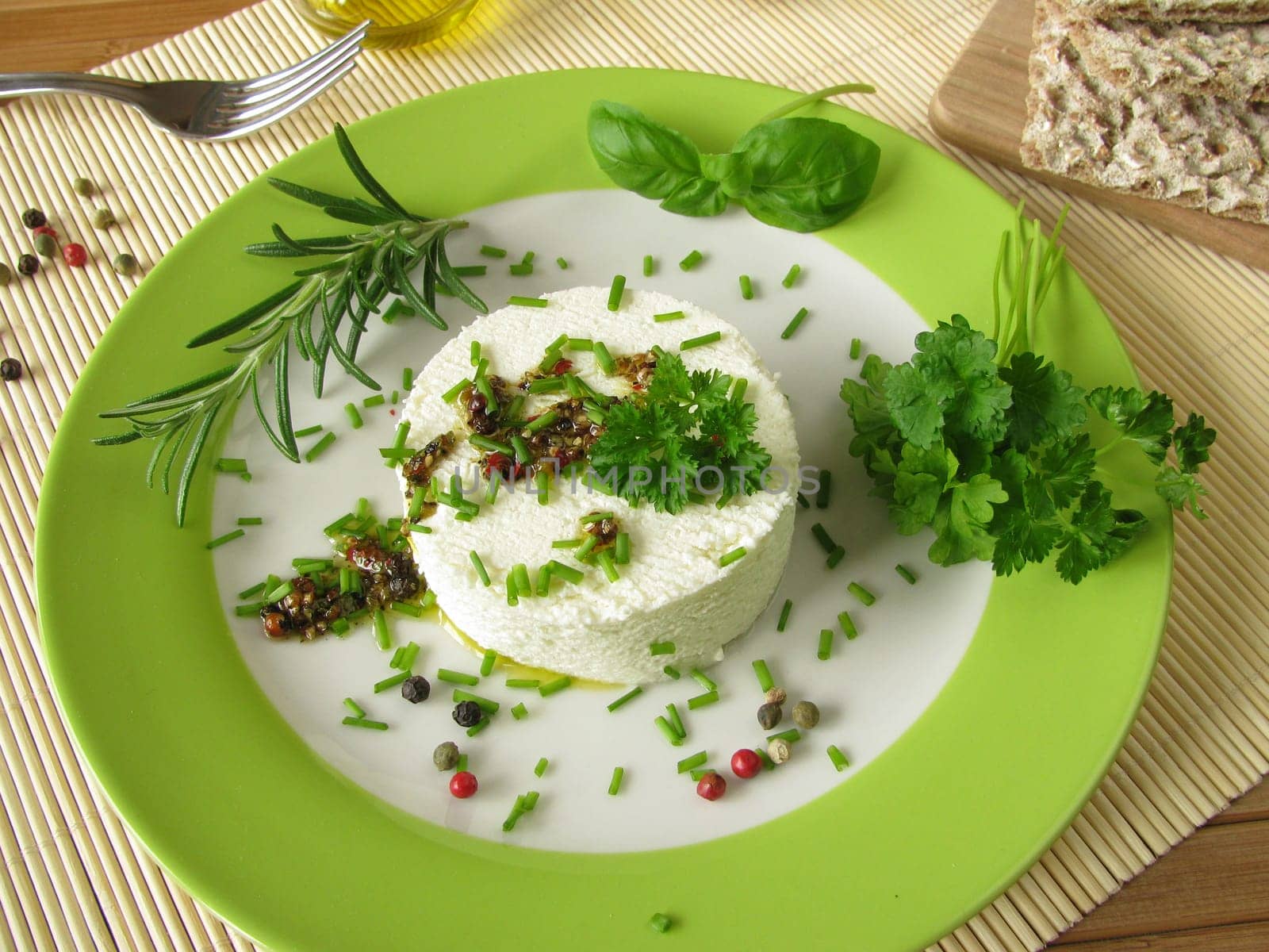 Goat's cream cheese with herb marinade and pepper