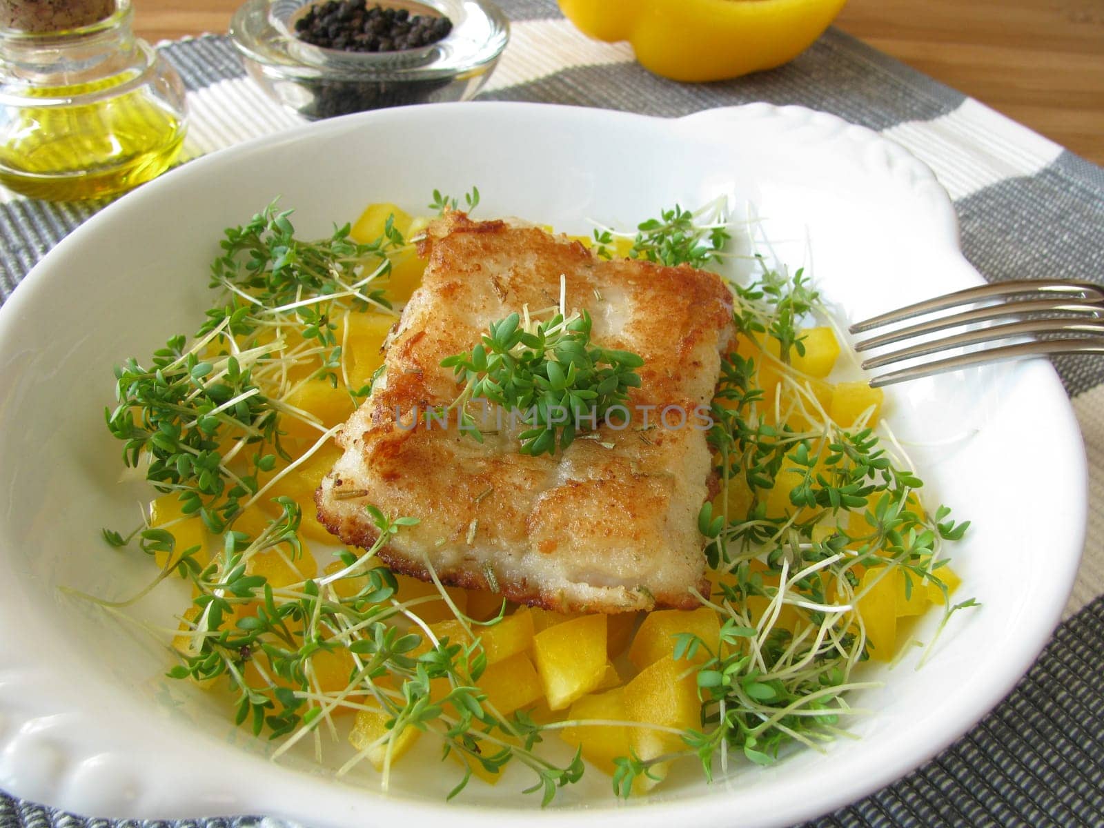Fish on peppers and cress