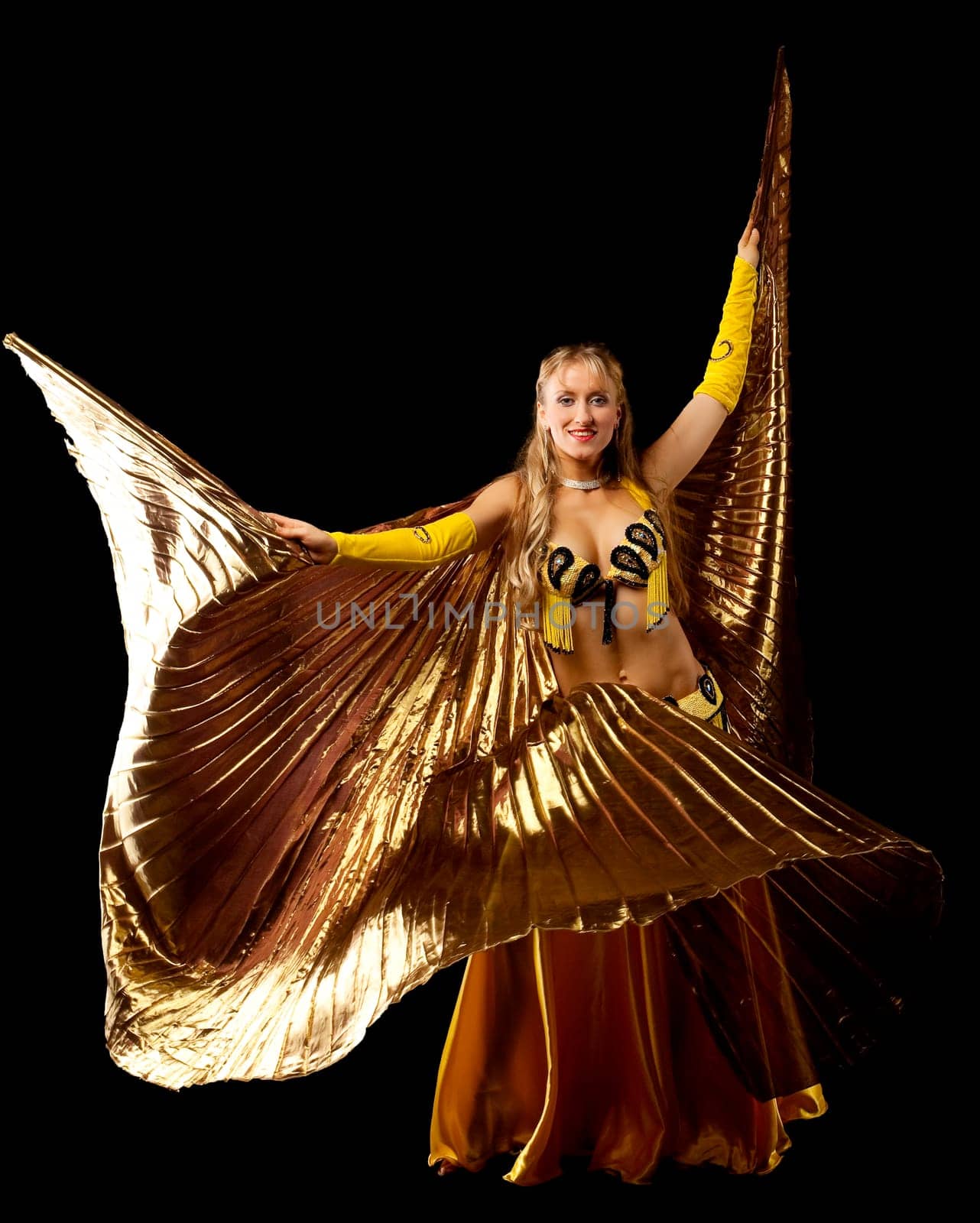 Beauty blond mature woman dance with gold wing arabian style