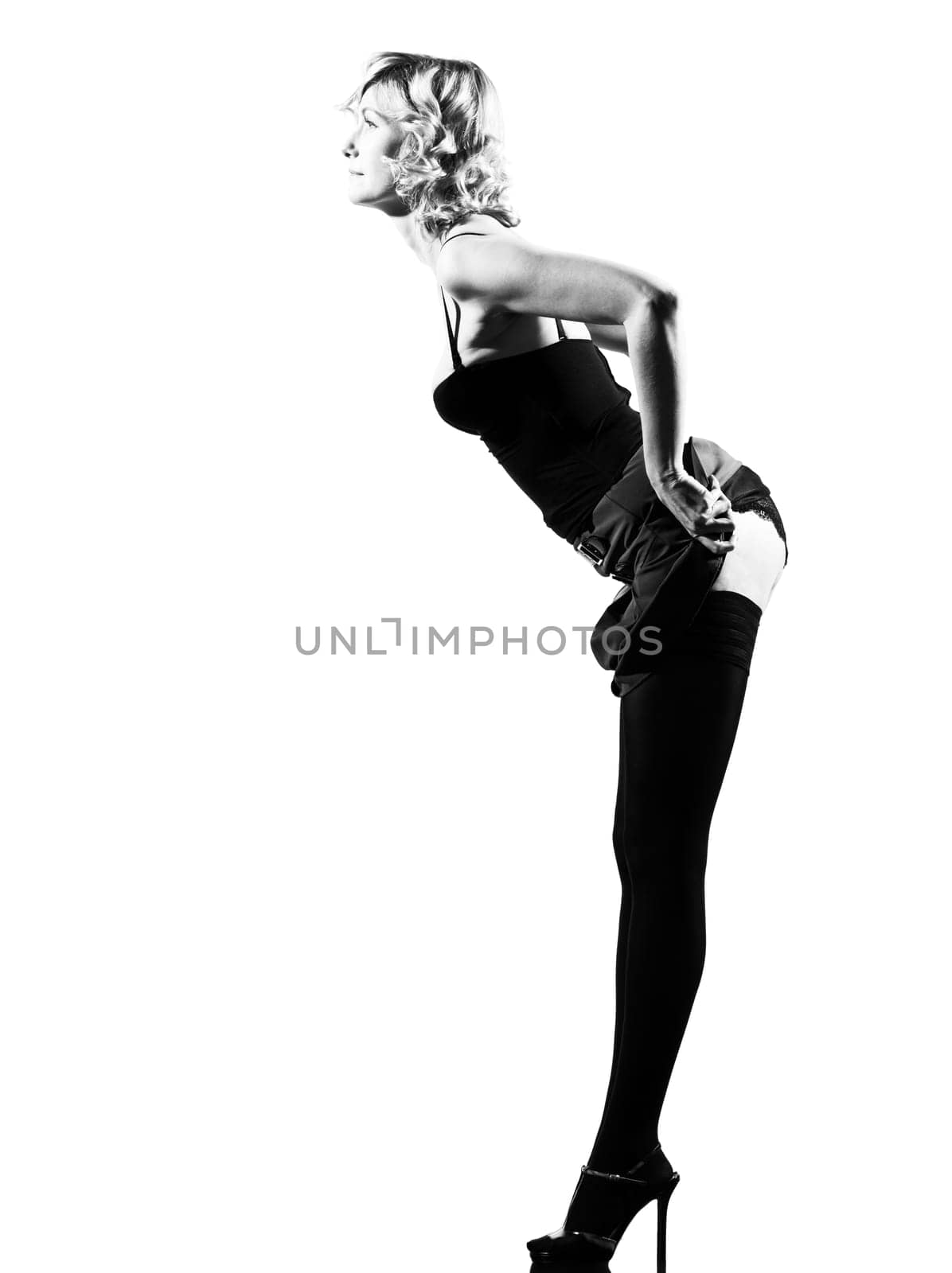 stylish silhouette caucasian beautiful woman sexy  attitude behavior clothes showing buttock full length on studio isolated white background