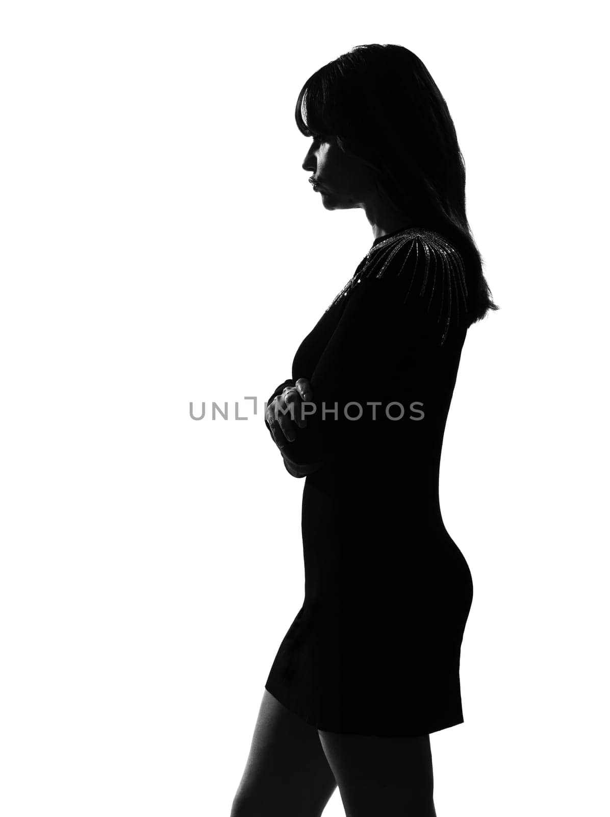 stylish sexy silhouette caucasian beautiful woman sullen sulking on studio isolated white background