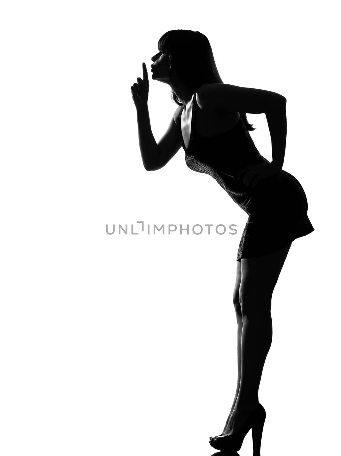 stylish silhouette caucasian beautiful woman hushing silence full length on studio isolated white background